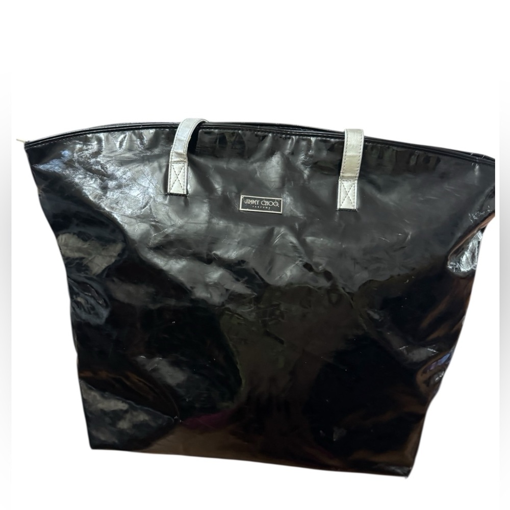 Jimmy Choo black patent
leather tote bag silver straps.